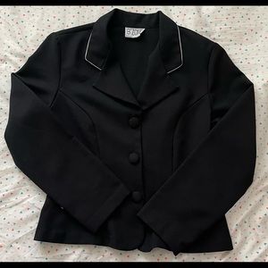 A 3 button black blazer with white details.